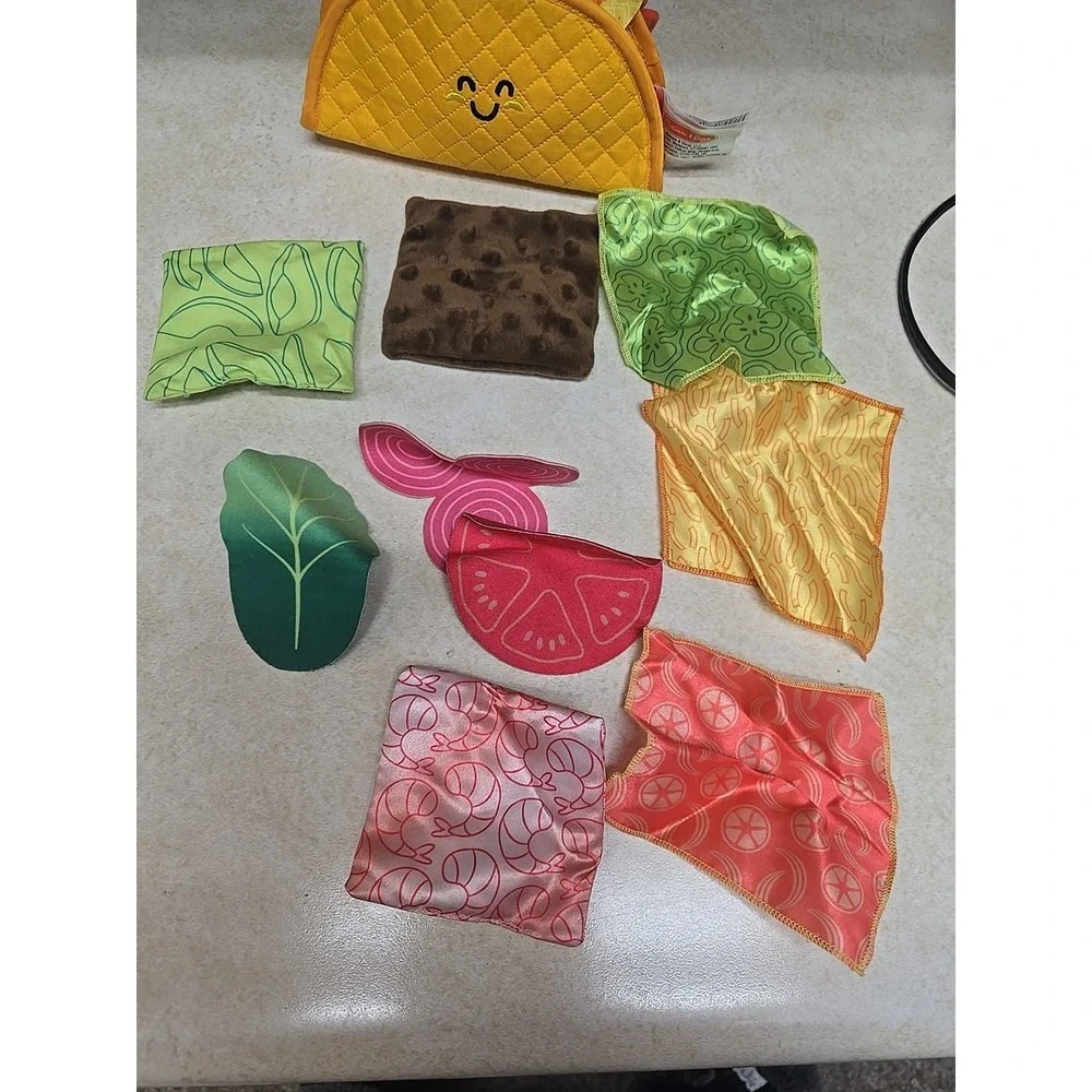 Melissa & Doug Multi-Sensory Soft Taco Fill & Spill Travel Infant Toddlers Toy‎